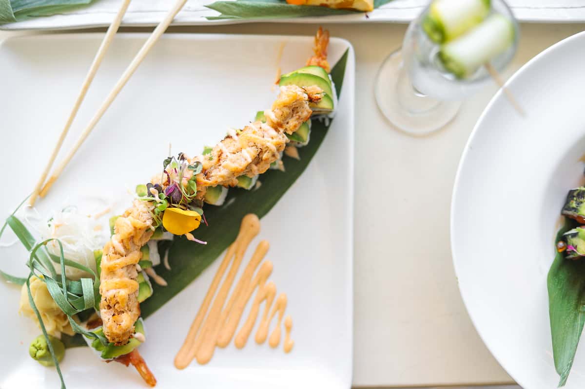 sushi rolls on leaf with spicy mayo