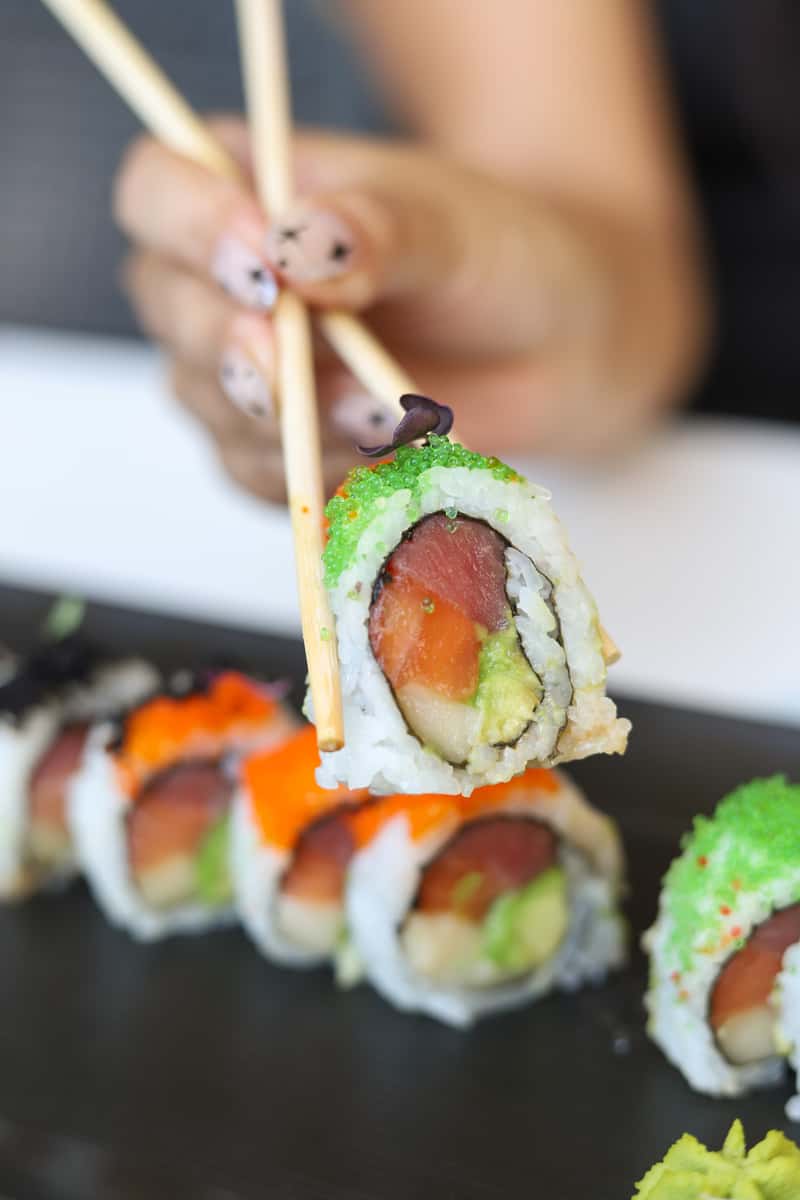chopsticks and sushi rolls