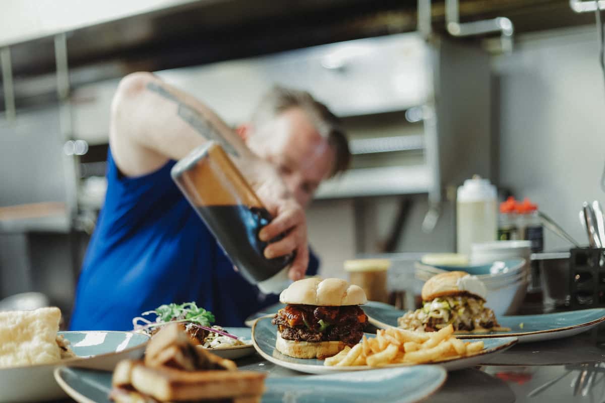 Everest burger being creating in the Talus Kitchen
