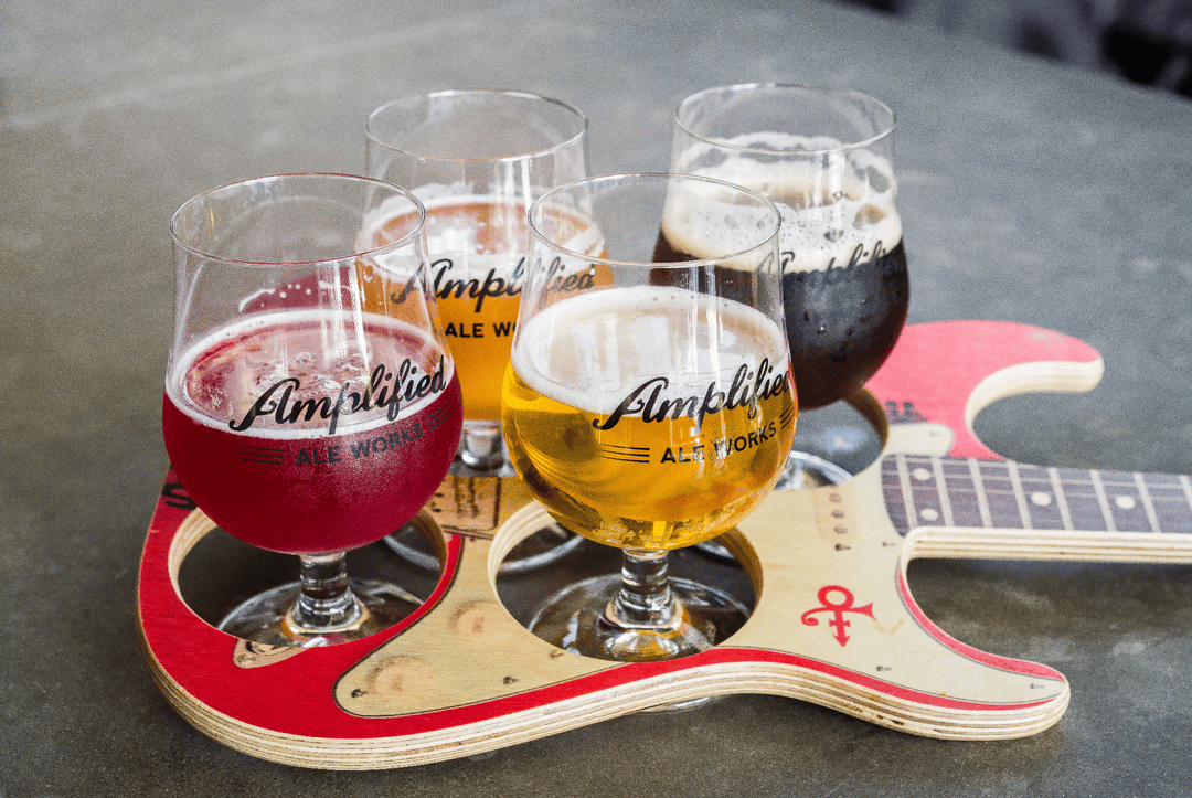 amplified ale works logo on beer flight in guitar shaped holder