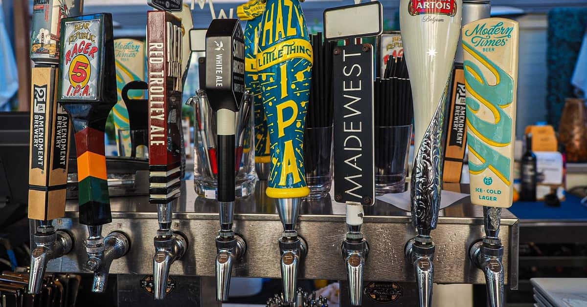 Craft beer tap wall featuring a wide selection of local and seasonal brews at a modern hotel restaurant and bar.