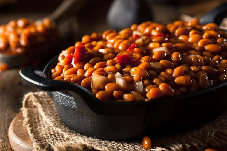 baked beans with diced peppers and onions in a skillet