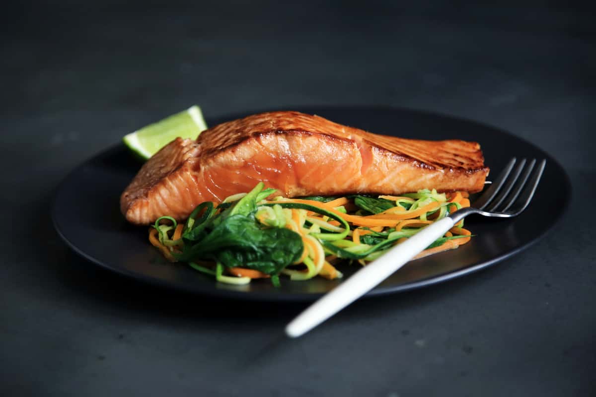 Salmon over seasonal vegetables