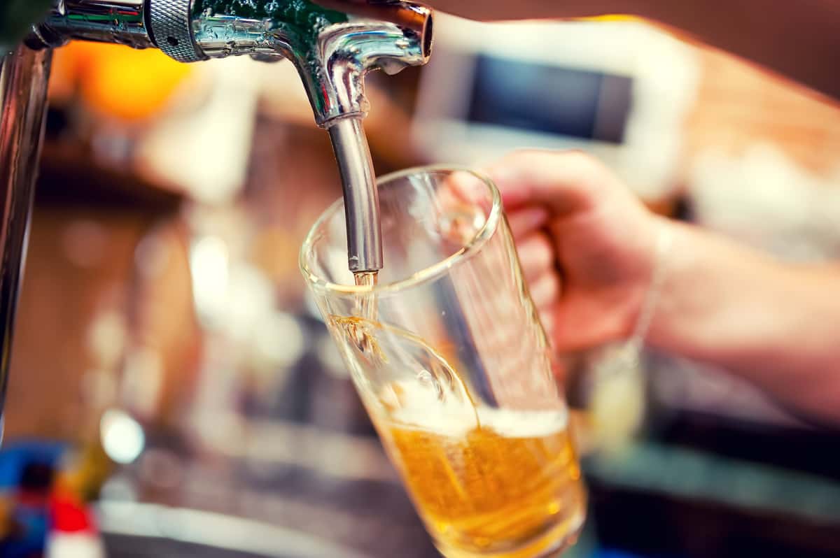 Beer being poured into mug