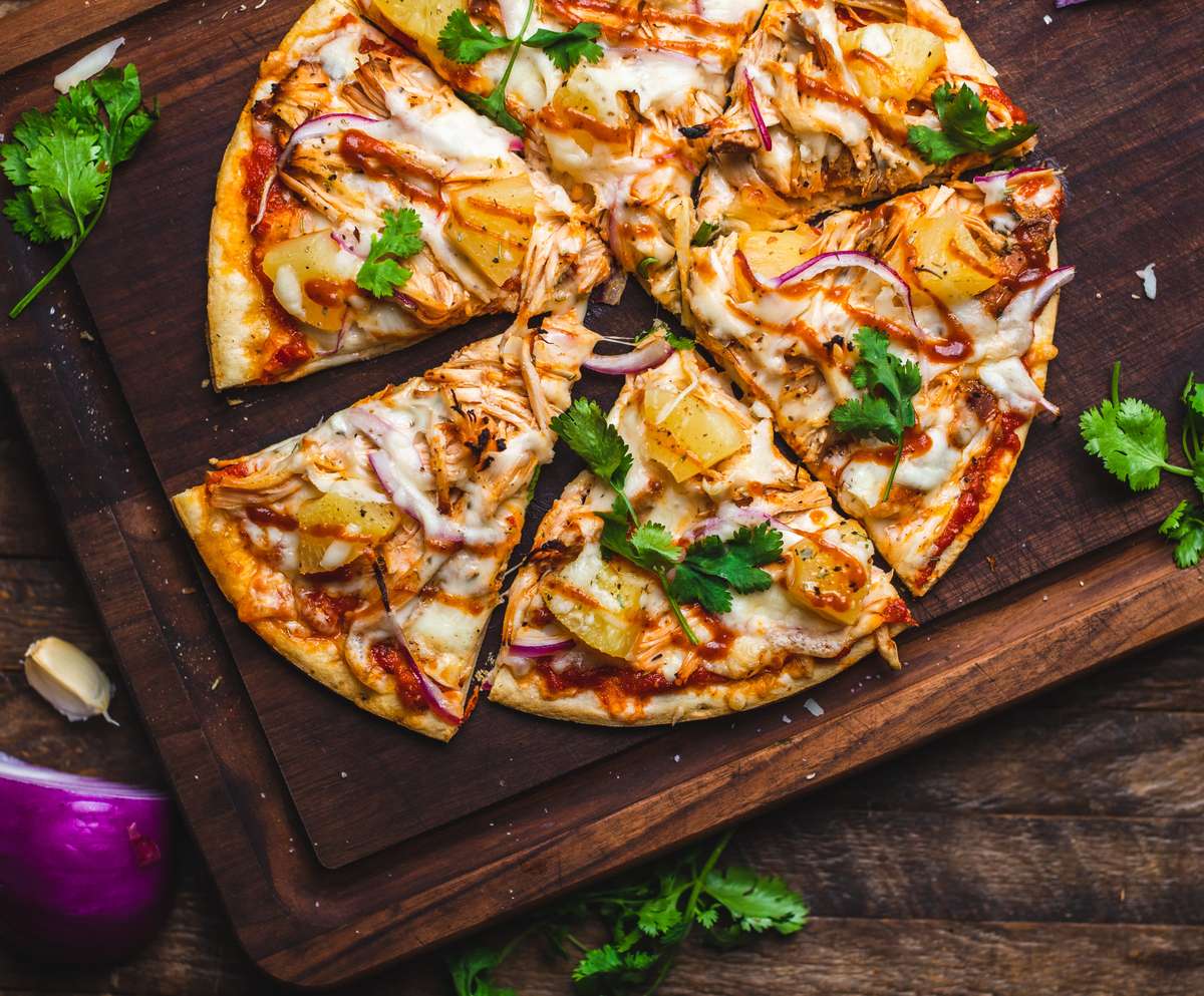 pizza on wood cutting table