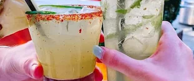 Mesero margaritas with Taj&iacute;n rims, available for pickup and delivery.