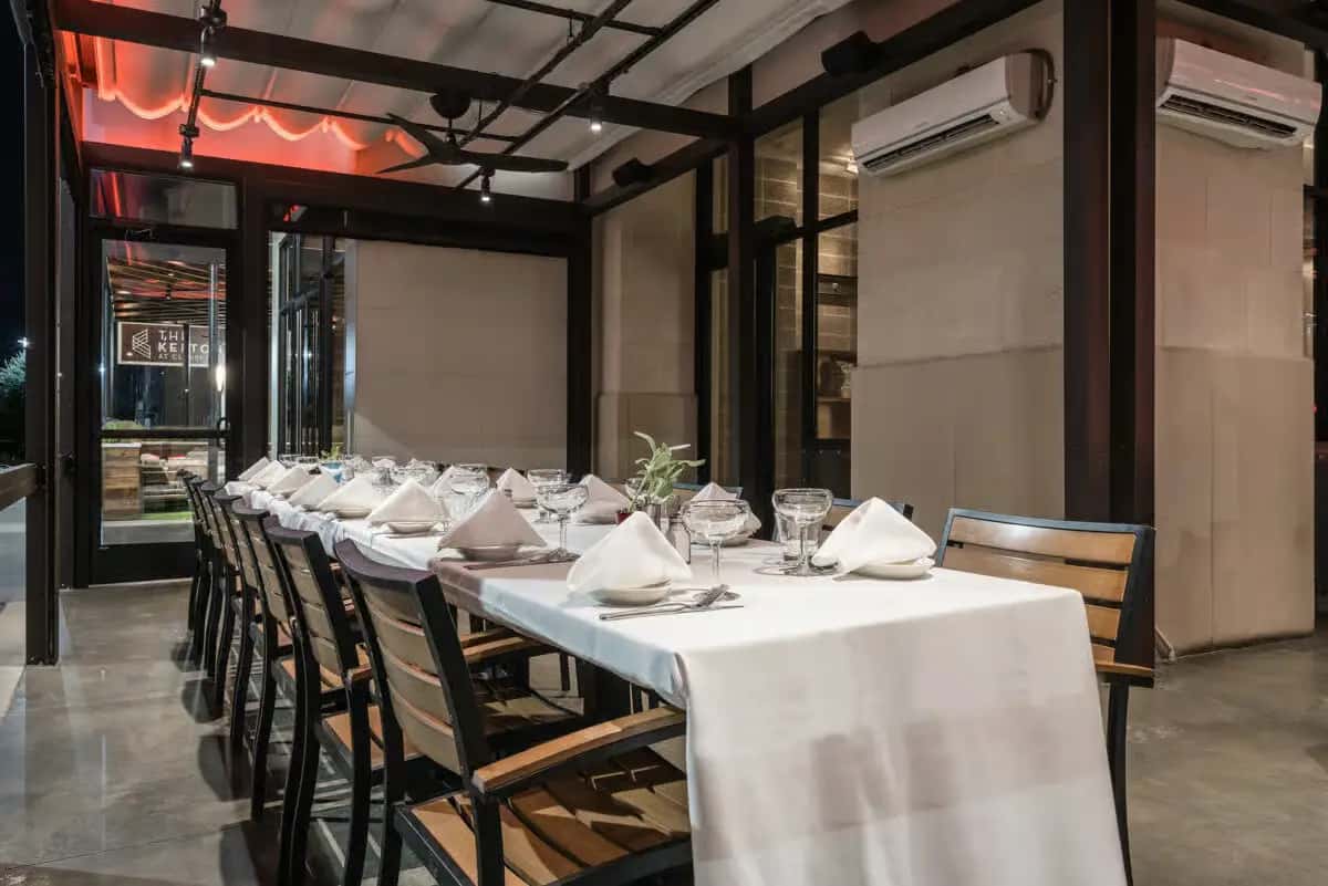 Mesero Mexican restaurant dining area with elegant tables set for guests.