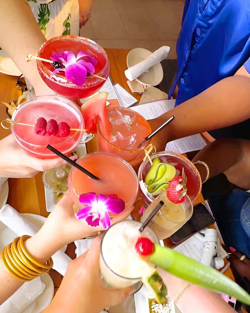 Colorful Mesero tequila cocktails and handcrafted margaritas being enjoyed at a celebration.