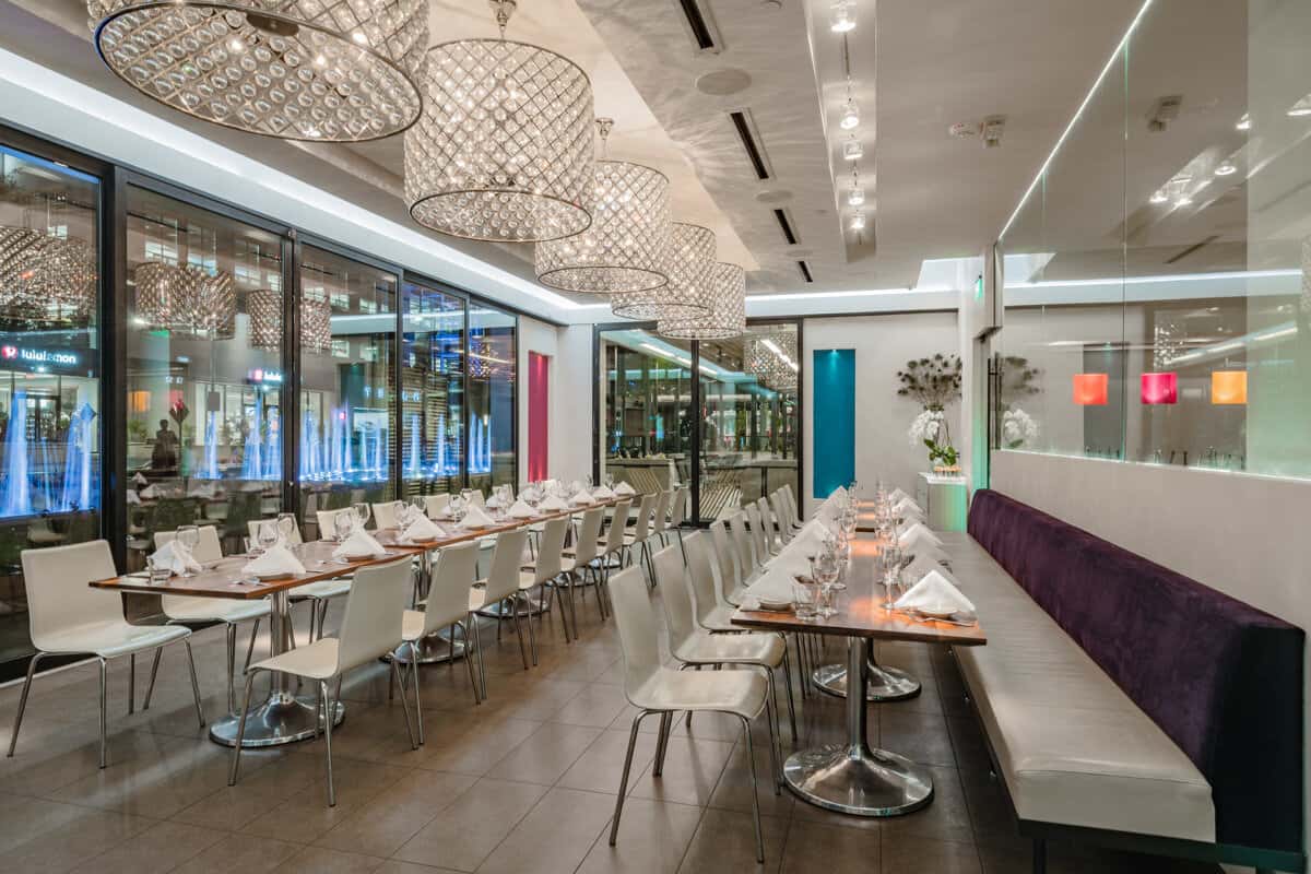 Private dining room at Mesero arranged for a restaurant celebration with a long group table