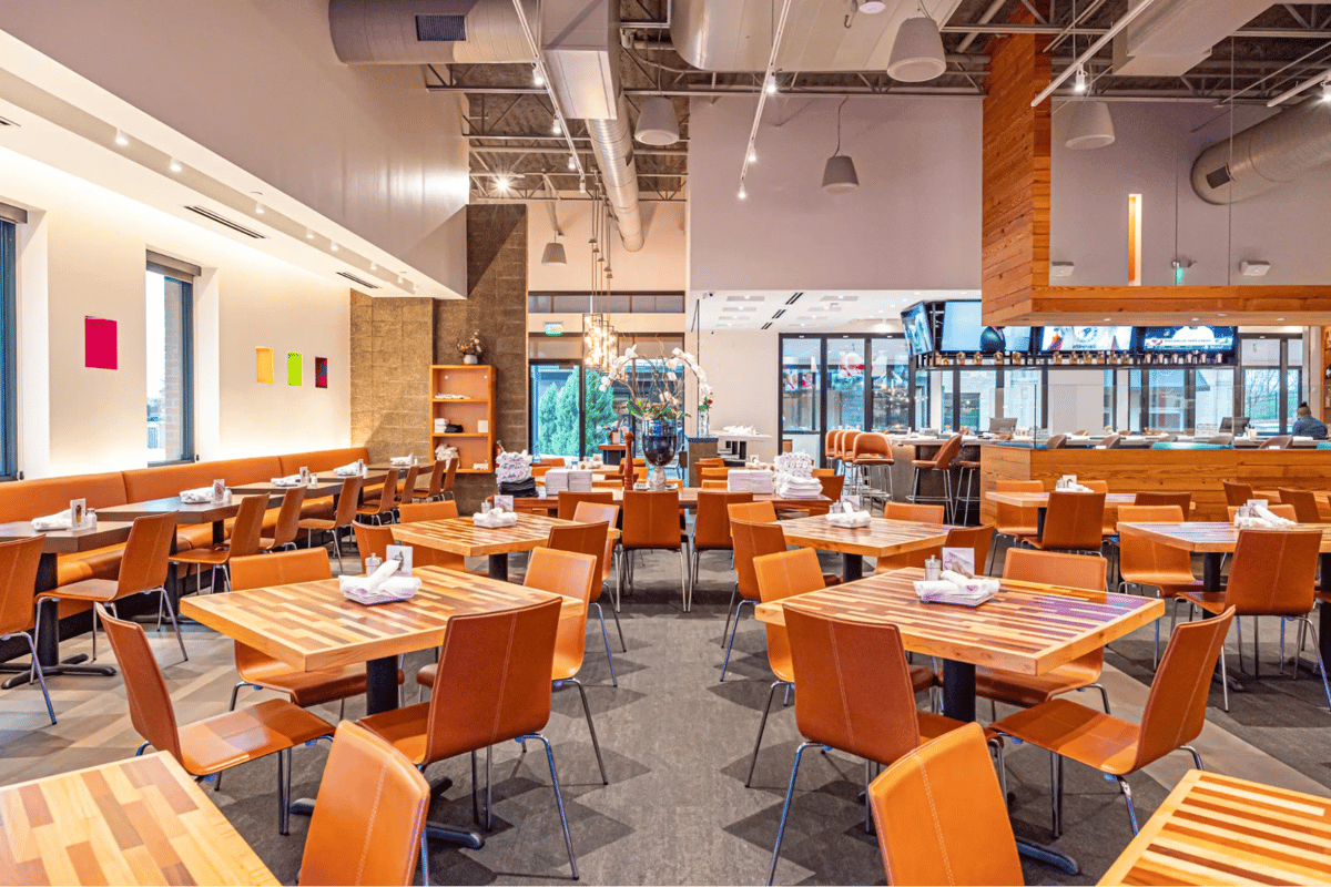 Interior view of Mesero's dining area with wooden tables and chairs.