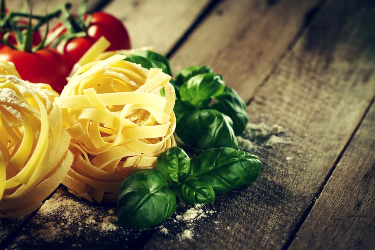 Fresh pasta with basil and tomatoes