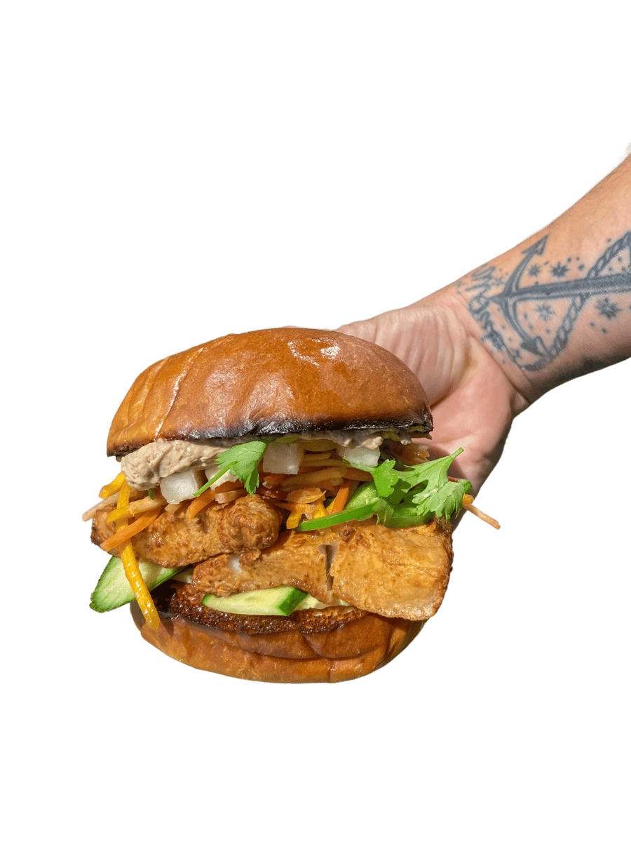 hand holding sandwich