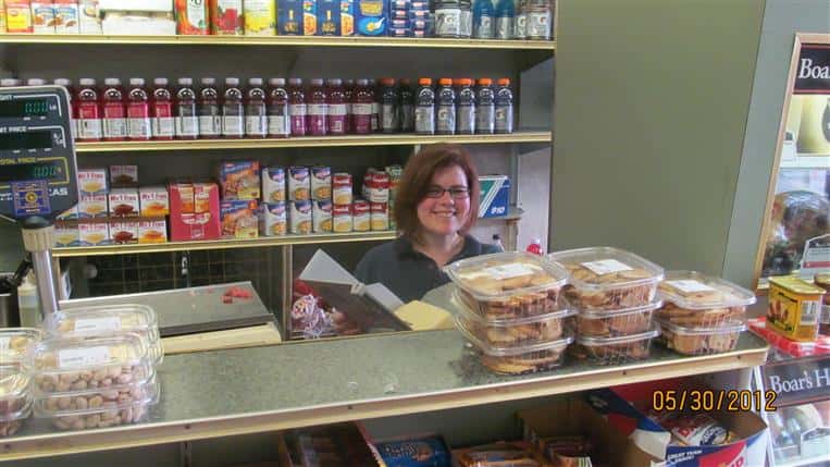 employee behind the counter smiling