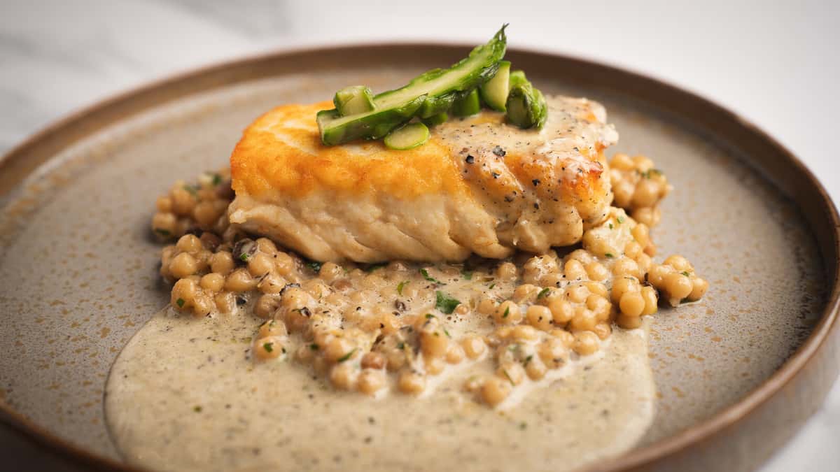 Seared halibut with shaved asparagus over fregola pasta and currants at 360 Bistro, Nashville