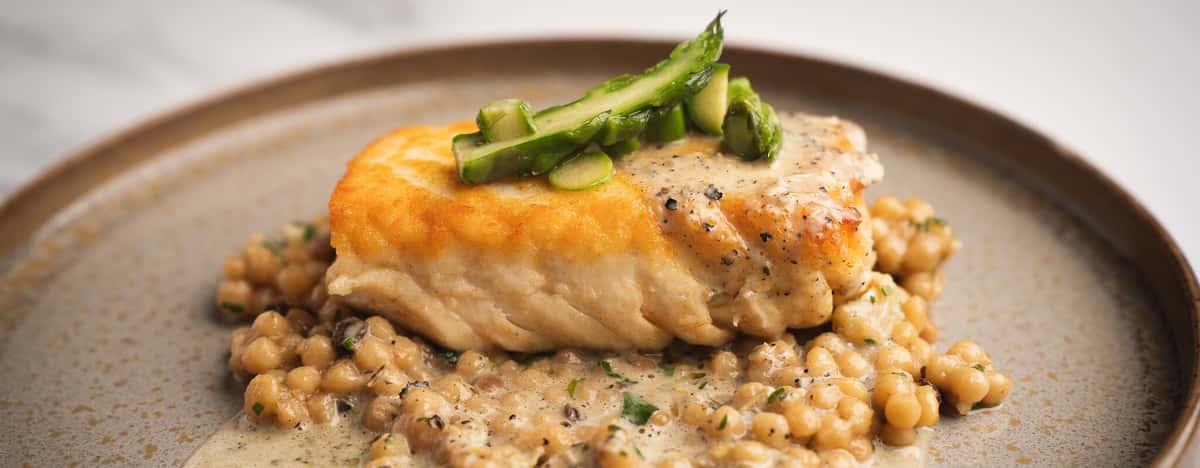 Seared halibut with shaved asparagus over fregola pasta at 360 Bistro, Nashville