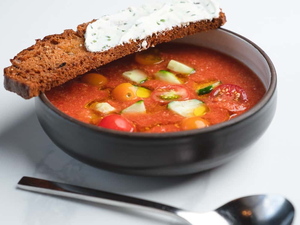 Chilled heirloom tomato gazpacho with herbed goat-cheese crostini at 360 Bistro
