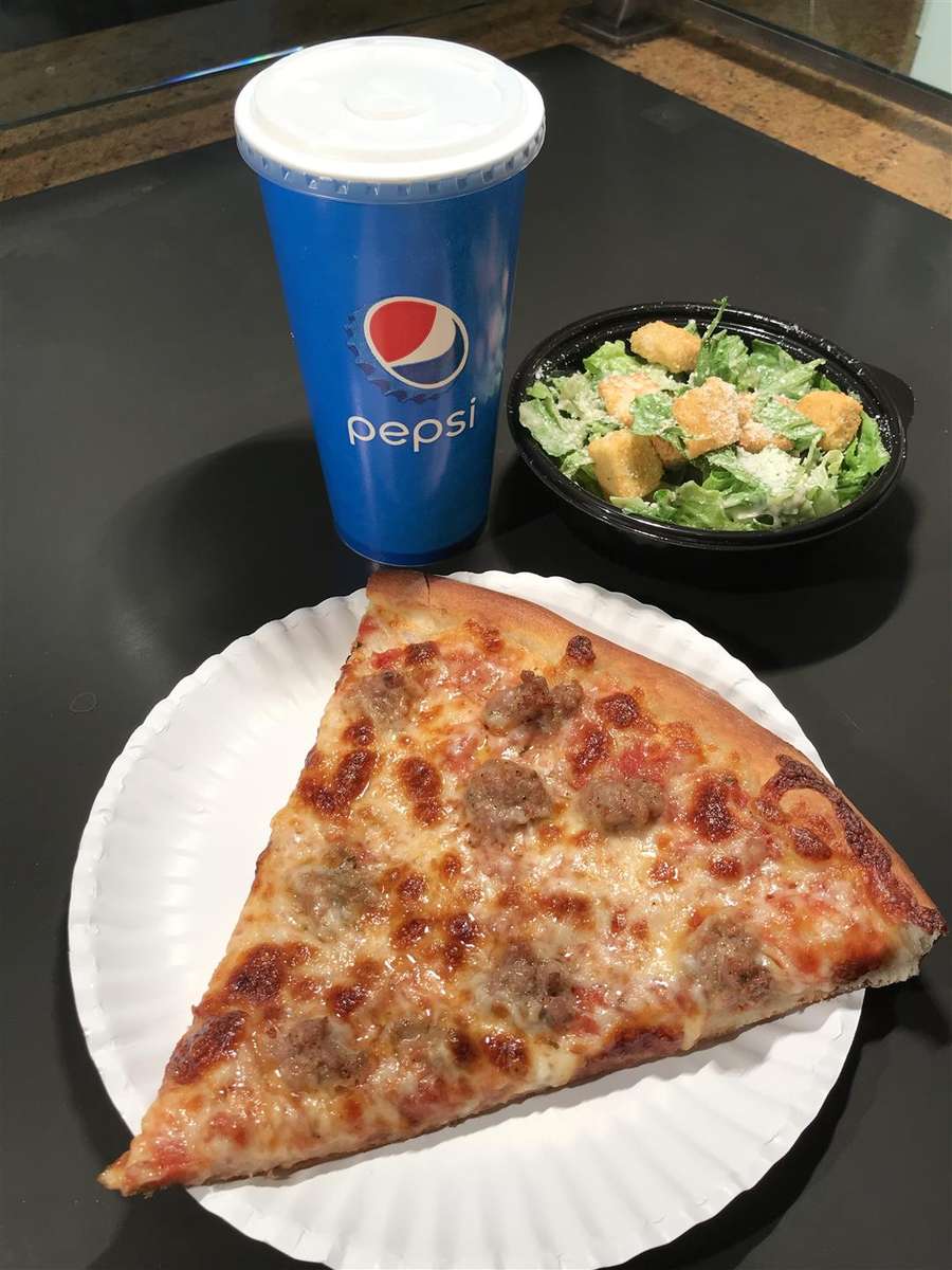 photo of sausage pizza NY style slice, regular size fountain drink & side caesar salad with crunch croutons.