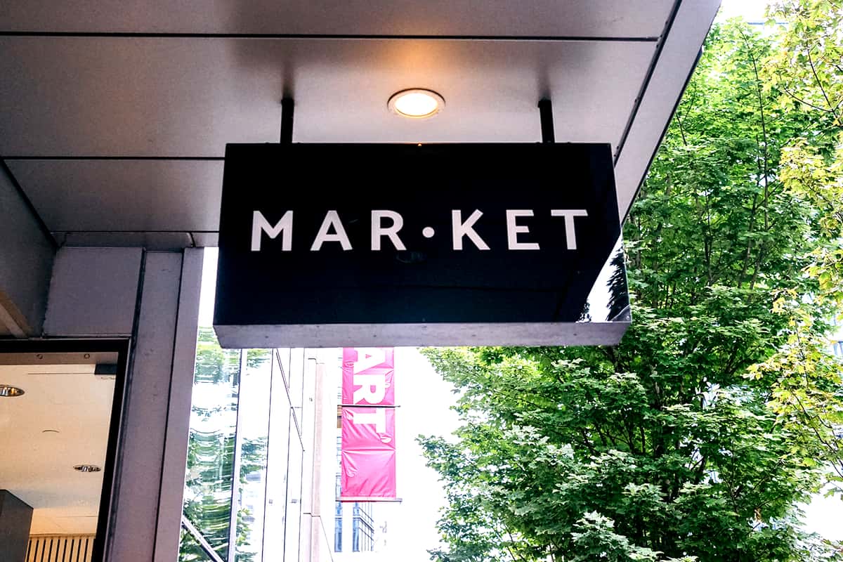 black hanging sign of Downtown Seattle location