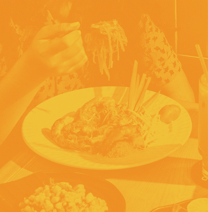Person eating a spoonful of Thai food from a plate