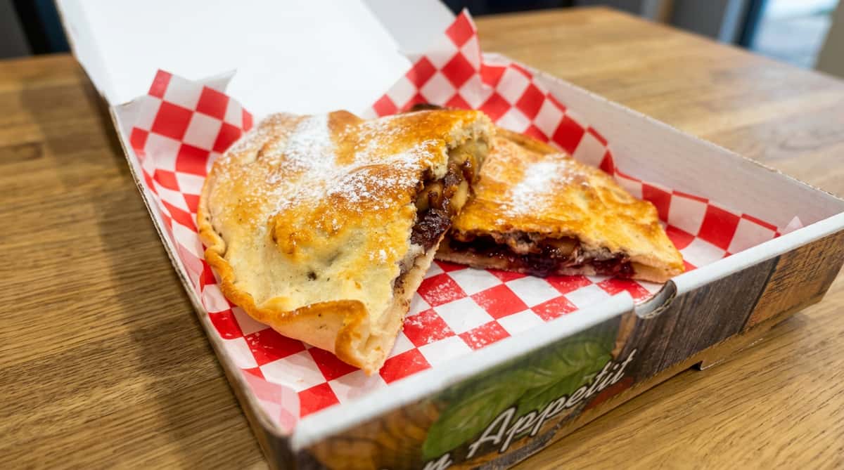 Sweet baked empanada with a golden flaky crust and rich filling from Ciao Bella takeaway in Westhill
