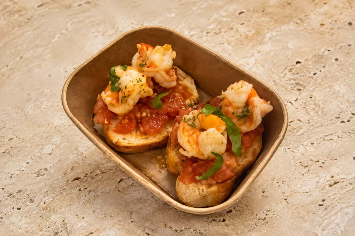 Italian-style bruschetta topped with prawns, tomatoes and fresh herbs from Ciao Bella