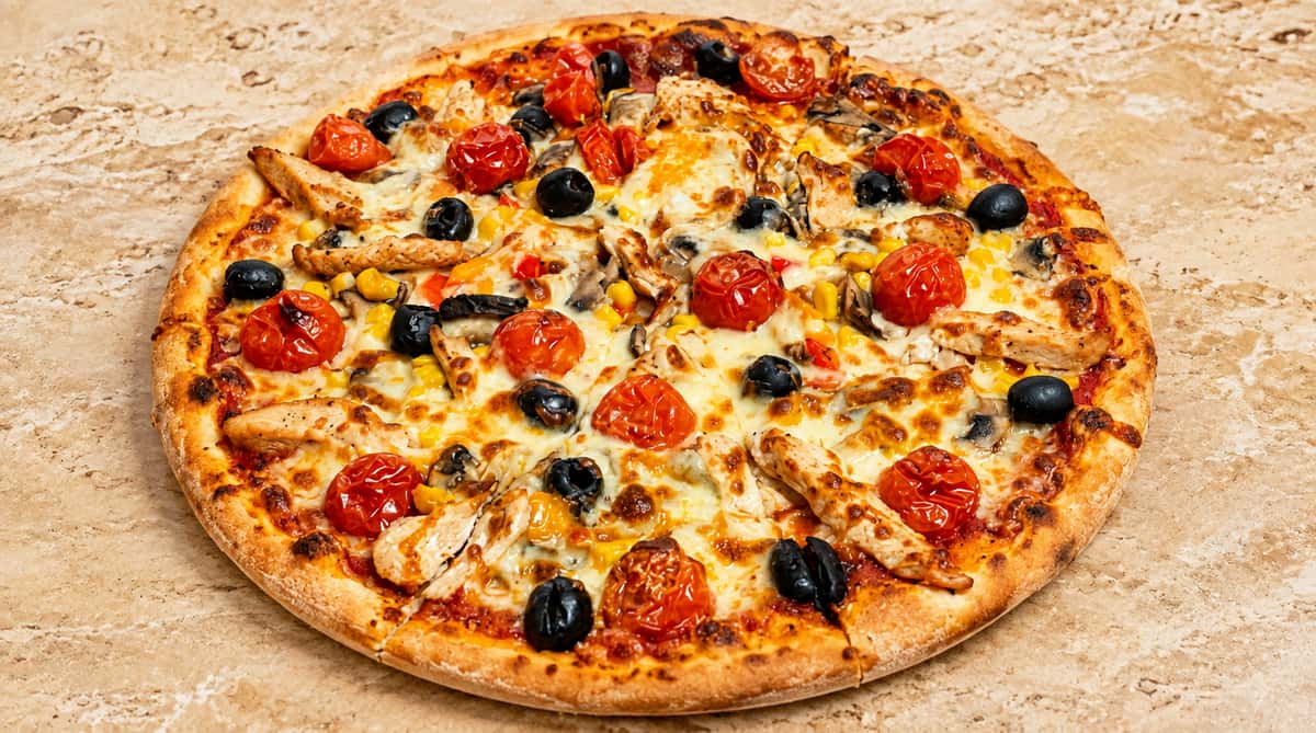 Supreme pizza topped with pepperoni, olives, peppers and melted cheese from Ciao Bella in Westhill