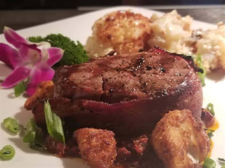 bacon wrapped sirloin steak and garnish