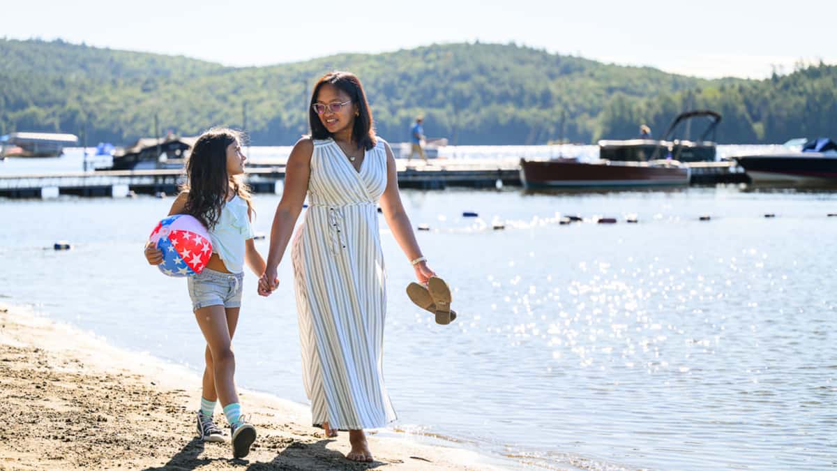 Mother and daughter enjoying a lakeside walk in Schroon Lake before Mother’s Day brunch