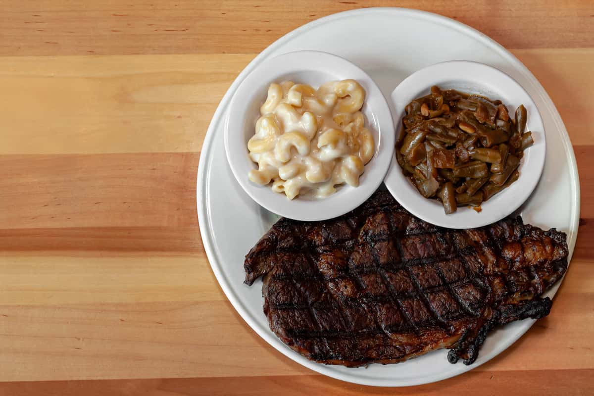 16oz. Ribeye With Green Beans And Classic Macaroni And Cheese