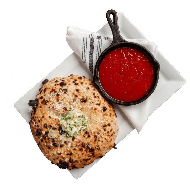 Sourdough garlic bread with herb butter and red sauce