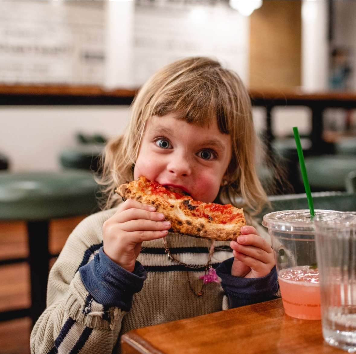 kid eating pizza