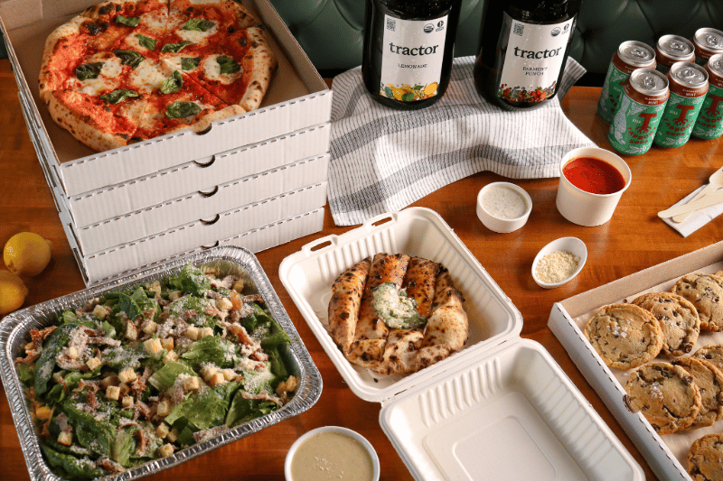 Mozz catering spread with pizza, drinks and desserts