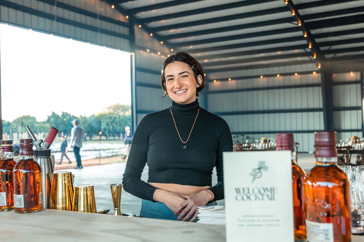 Sommelier preparing a premium beverage experience with spirits and cocktail service at an upscale Miami restaurant.