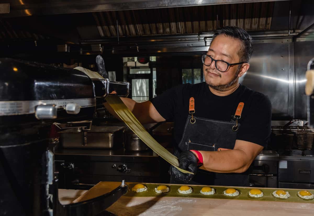 Chef preparing fresh ravioli pasta in a professional restaurant kitchen
