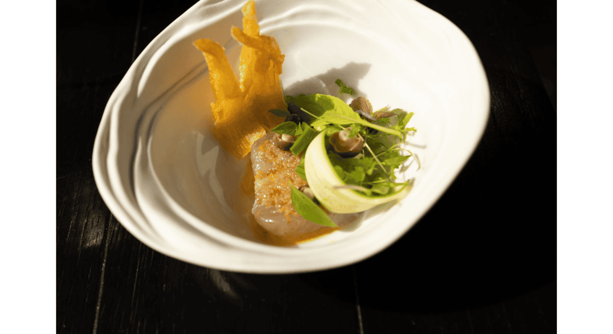 Artfully plated seafood course showcasing refined presentation and precision typical of Michelin-star dining at Stubborn Seed Miami.