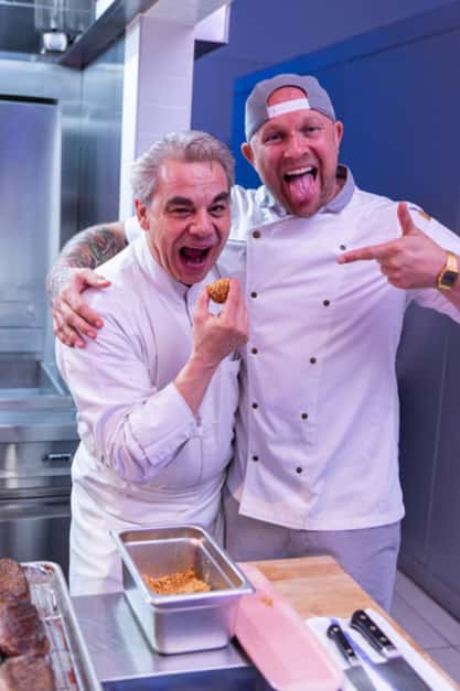 Jeremy Ford laughing and posing with fellow chef