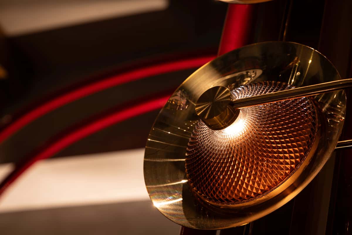 Brass decorative light fixture adding warm ambient lighting to an upscale restaurant interior