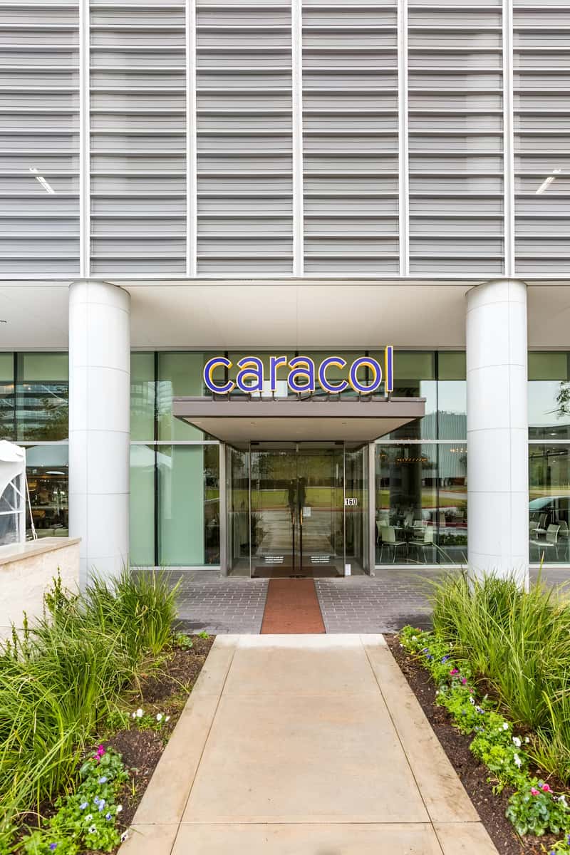 Exterior entrance of the restaurant featuring modern architecture and signage.