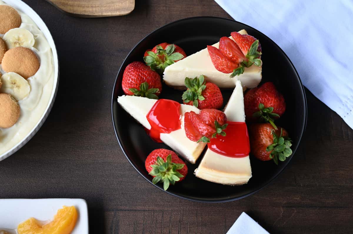 three slices of strawberry cheesecake