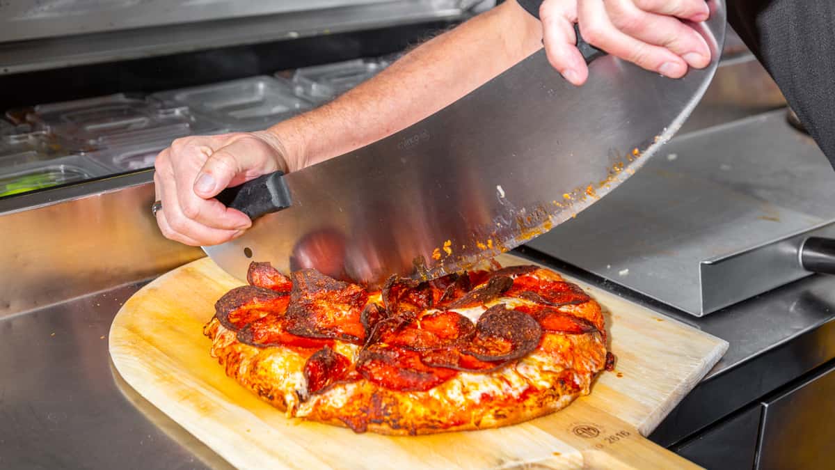 Pizza Getting Cut