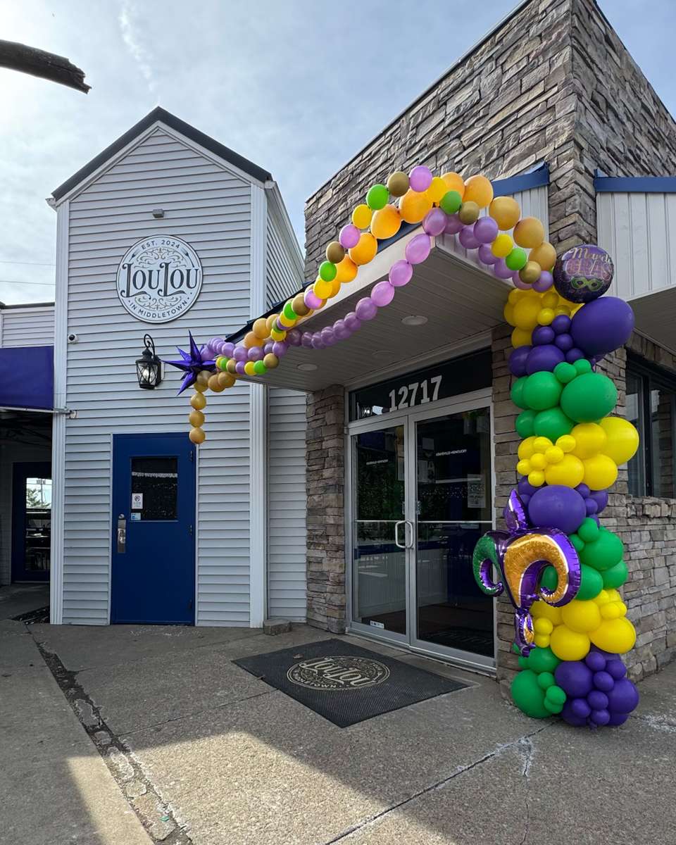 Lou Lou in Middletown storefront decorated for Mardi Gras