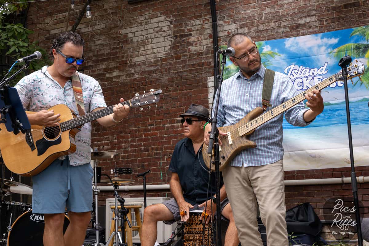 Band performing on the Island Rock Fest stage at Lou Lou on Market