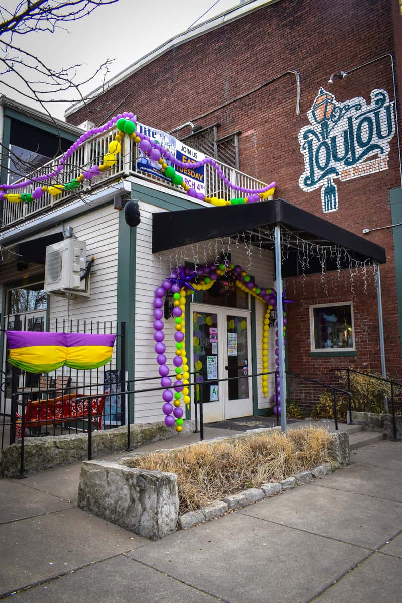 Lou Lou on Market storefront decorated for Mardi Gras