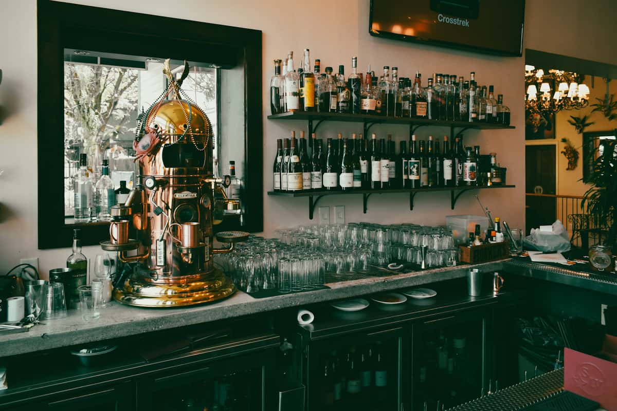 The stylish bar at Lou Lou on Market, offering an extensive selection of craft cocktails, wines, and top-shelf spirits.
