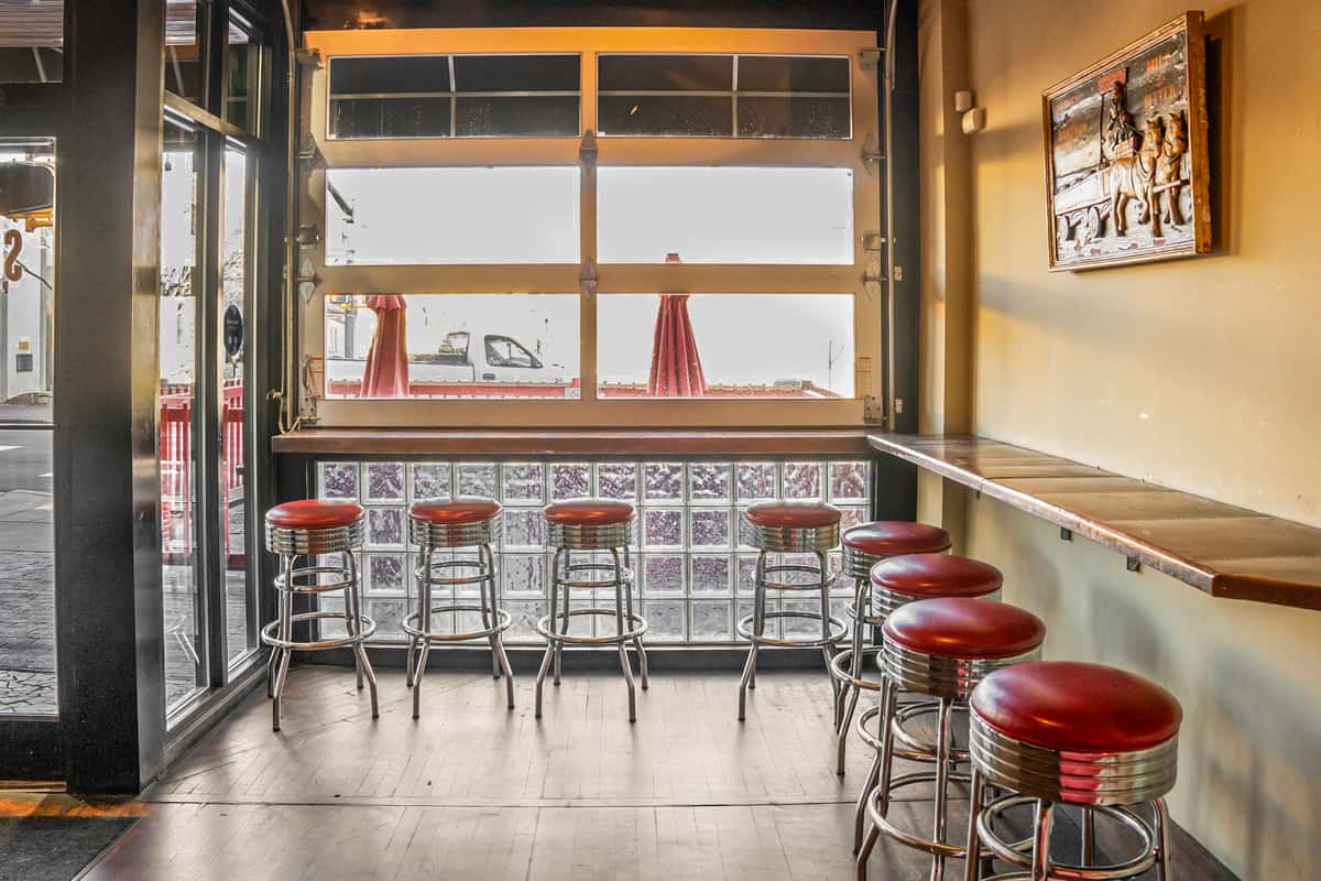 bar stools and window seating area