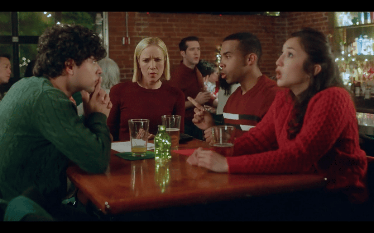 Three friends sitting at a lively tavern bar, smiling and enjoying drinks together in a warm, social atmosphere.