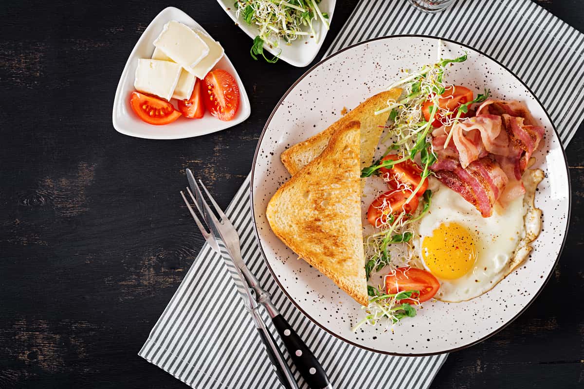 toast, eggs, bacon and salad
