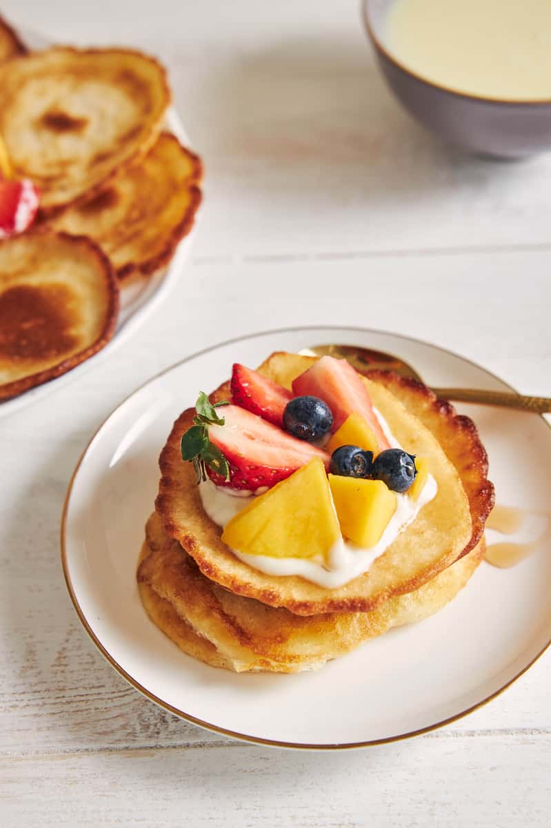 vertical-shot-pancakes-with-fruits-top-breakfast