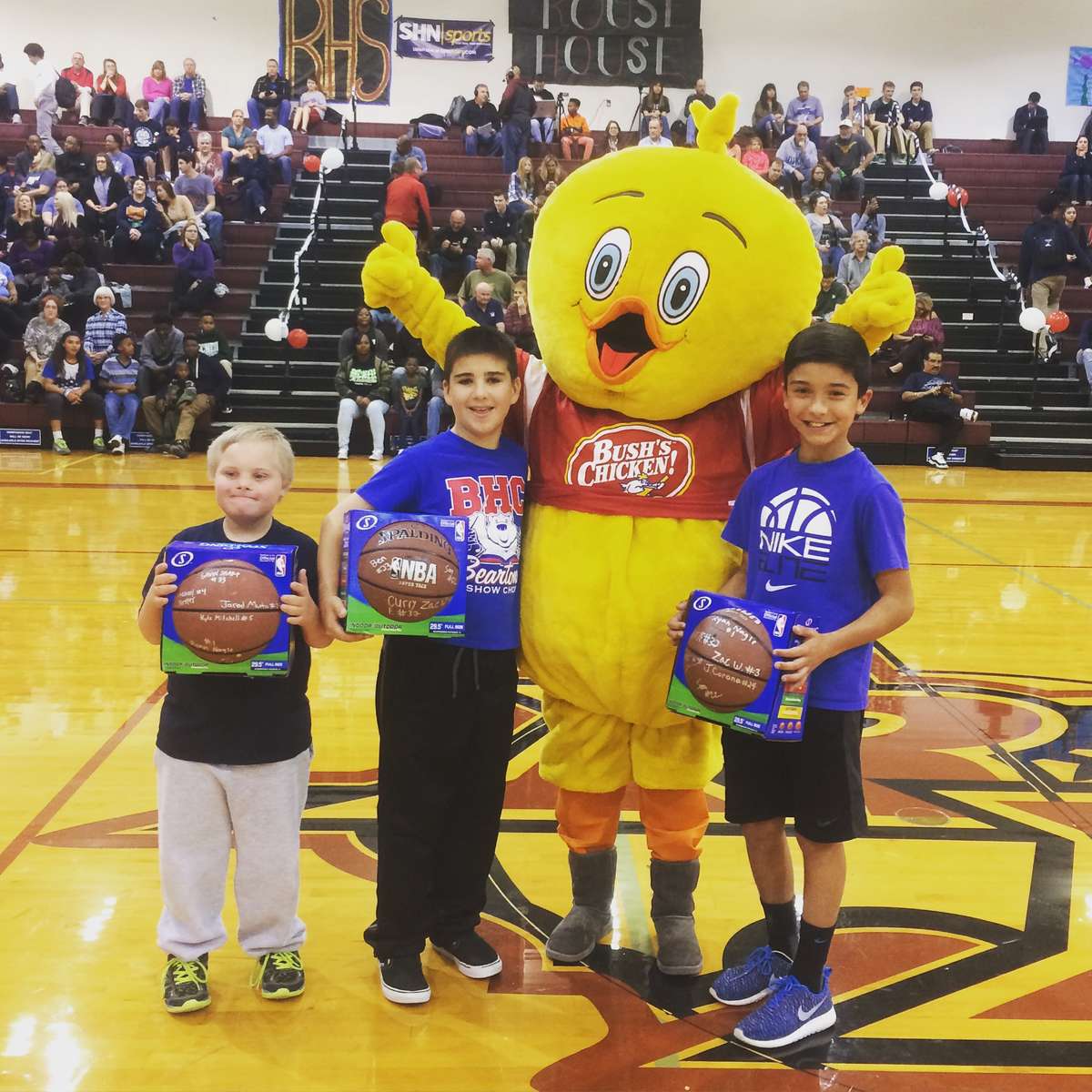 chicken mascot with student athletes