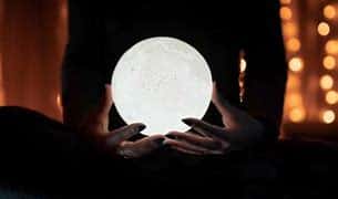 medium holding crystal ball